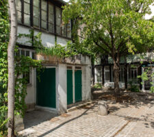 The entrance of a villa on a summer street in France